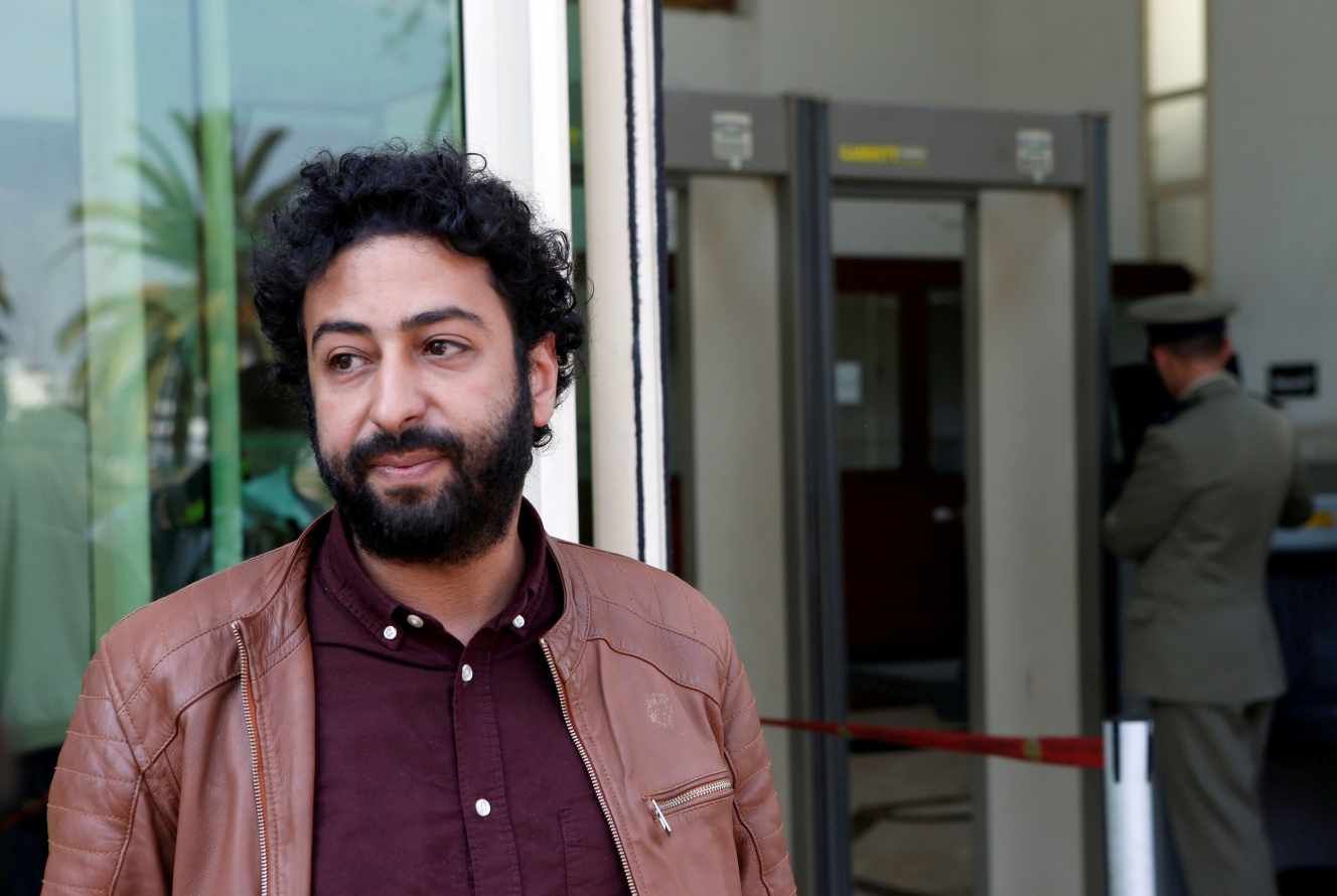 FILE PHOTO: Journalist and activist Omar Radi waits outside court in Casablanca, Morocco March 12, 2020. REUTERS/Youssef Boudlal/File Photo
